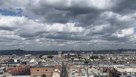 paris cityscape under cloudy sky