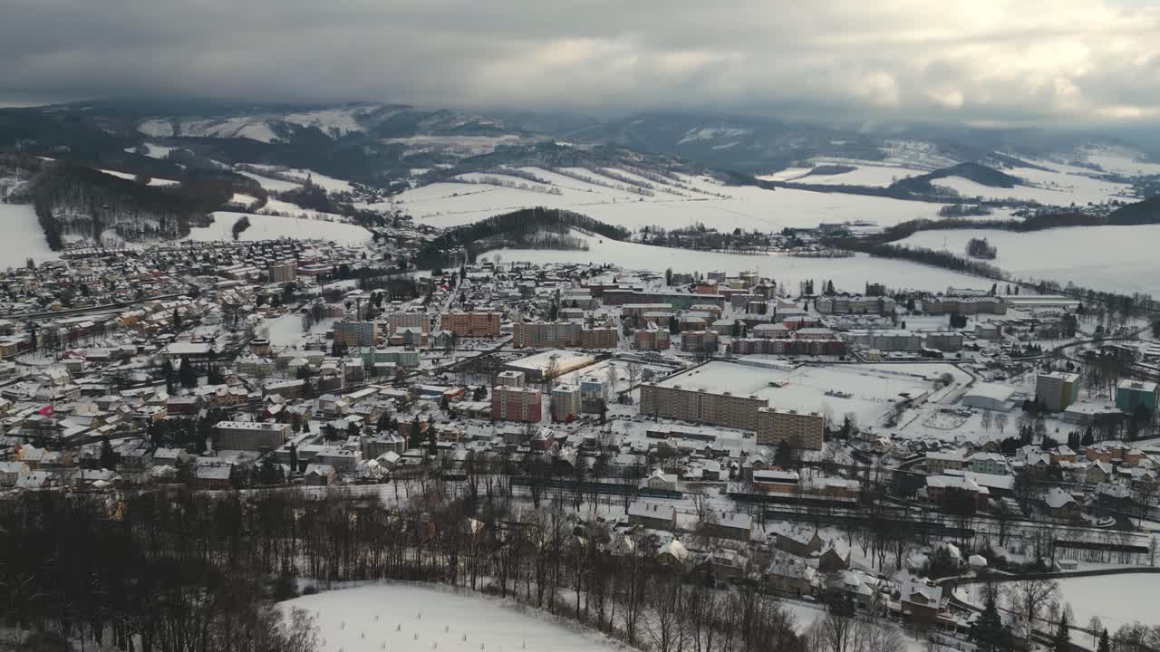 Aerial view of the mountain town of Jesen&iacute;k in the valley below the Jesen&iacute;ky Mountains