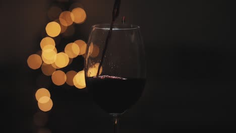 pouring red wine for christmas in a slow motion