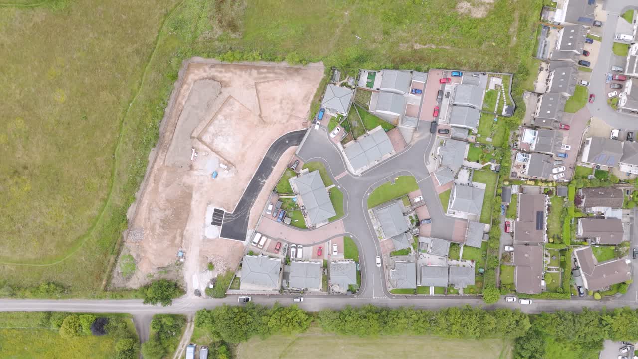 Aerial View of a Residential Housing Development with Adjacent Construction Site