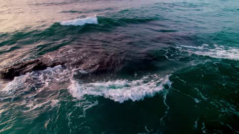 Ocean-waves,-moving-backwards-and-tilting-up-into-the-horizon