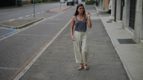 woman walking on city street