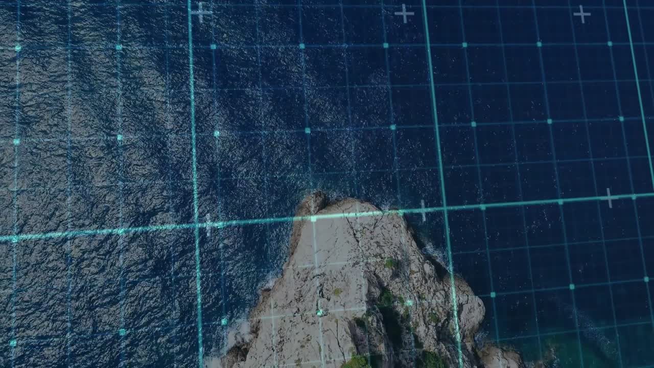 View tilting and zooming tracking promontory as pulsing grid lines scanning ocean for mapping