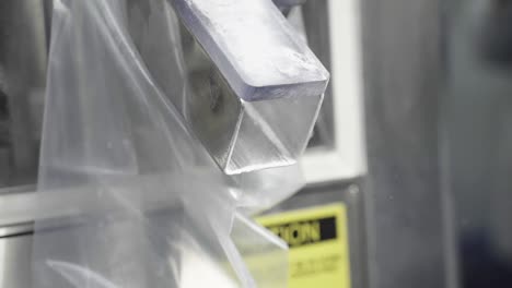 pills coming out of a pill-making machine