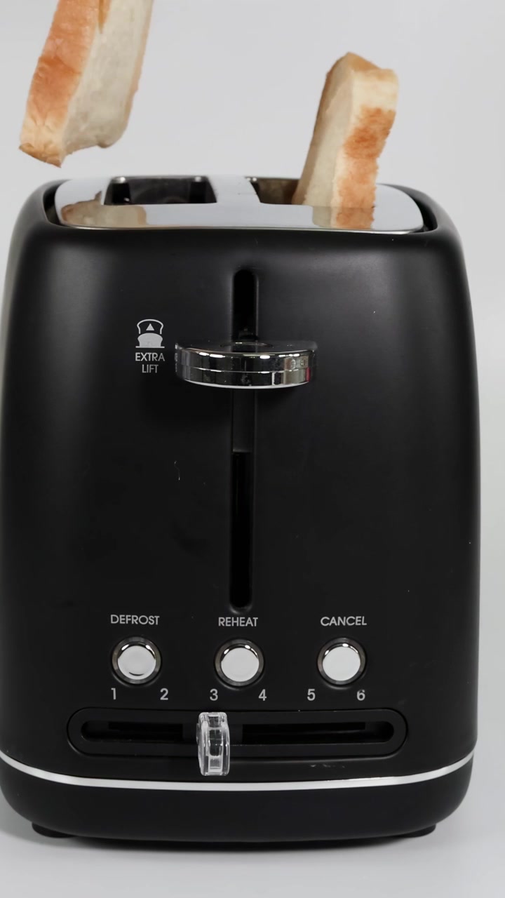 Placing bread slices into a toaster