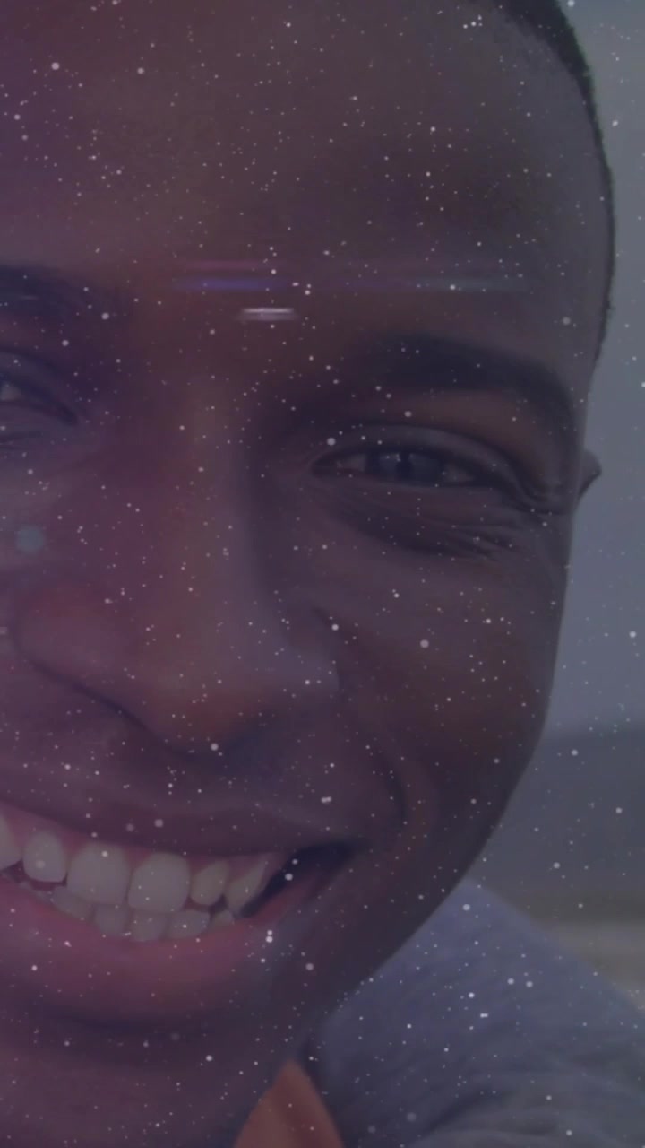 Vertical video: Front camera starting man smiling tilting head starry flares on face boosting ads
