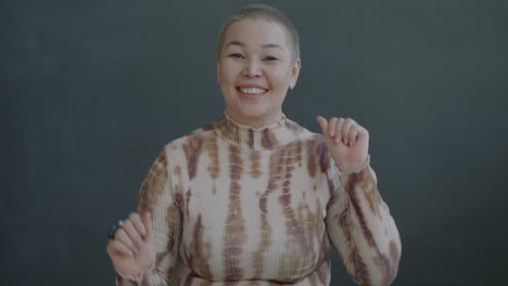 happy woman in tie-dye shirt