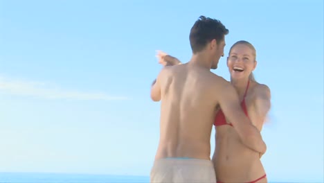 beautiful couple dancing on a beach