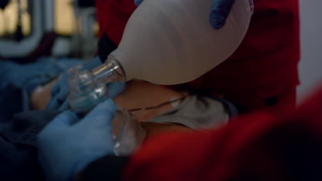 emergency medical doctors hands doing cpr procedure of patient on stretchers