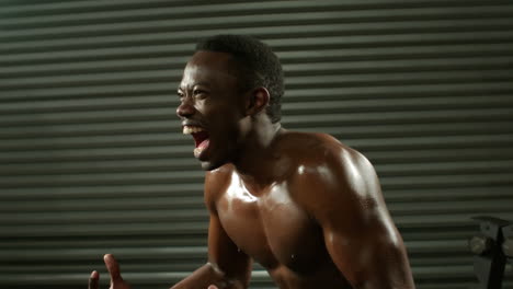 fit excited muscular man screaming