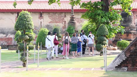 group of visitors touring historical site outdoors