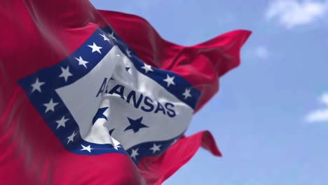 the state flag of arkansas waving in the wind