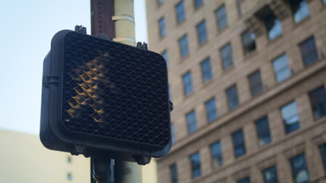 Closeup-pedestrian-traffic-light-allowing-cross-street-in-modern-megapolis.