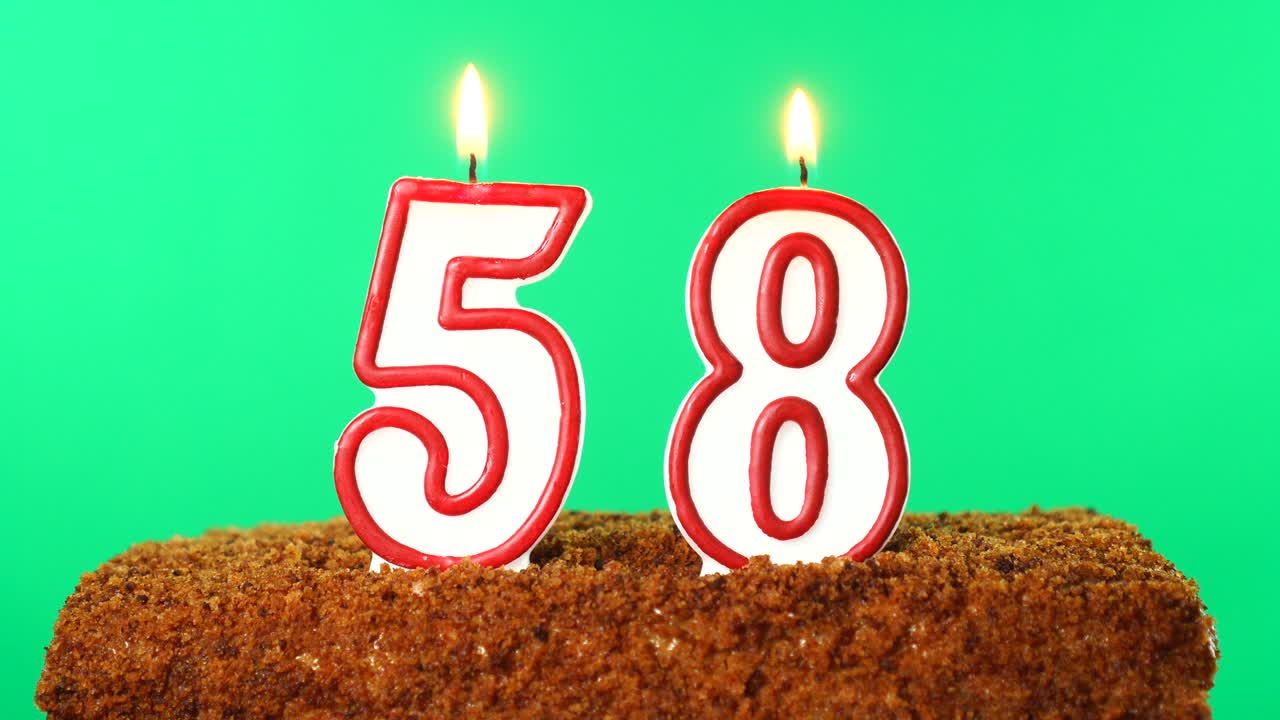 Cake with the number 58 lighted candle. Chroma key. Green Screen. Isolated