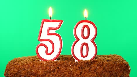 Cake with the number 58 lighted candle. Chroma key. Green Screen. Isolated