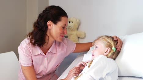 Mother-interacting-with-her-sick-daughter