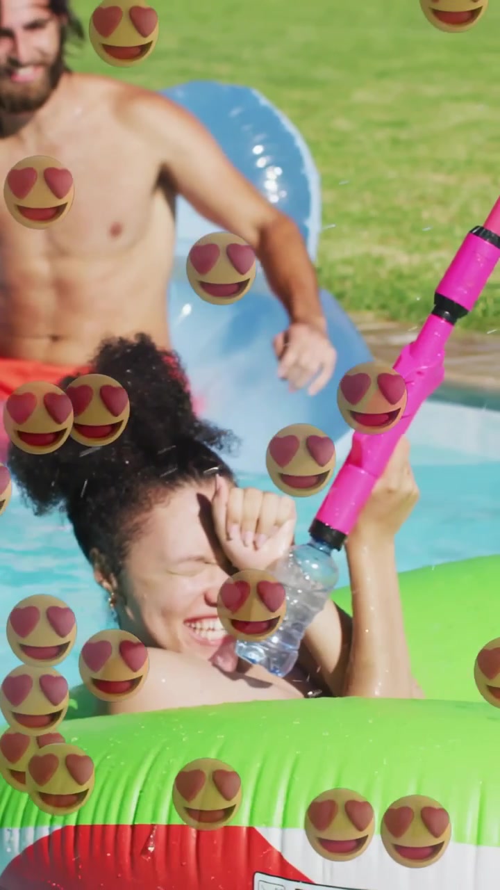 Vertical video: She sitting ring man splashing she shielding and aiming gun while playing emoji ads