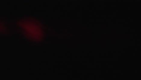 close-up of particles in red light beam