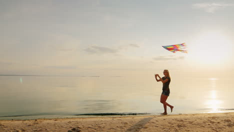 Carefree-Young-Woman-Running-On-The-Beach-With-A-KiteSteadicam-Slow-Motion-Shot