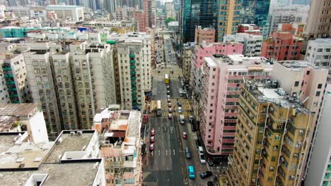 Downtown-Hong-Kong-buildings,-Crosswalk-and-traffic,-High-altitude-aerial-view