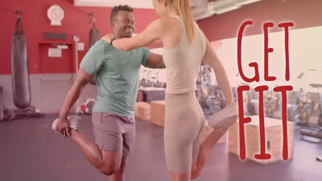 animation of get fit text over diverse man and woman exercising in gym