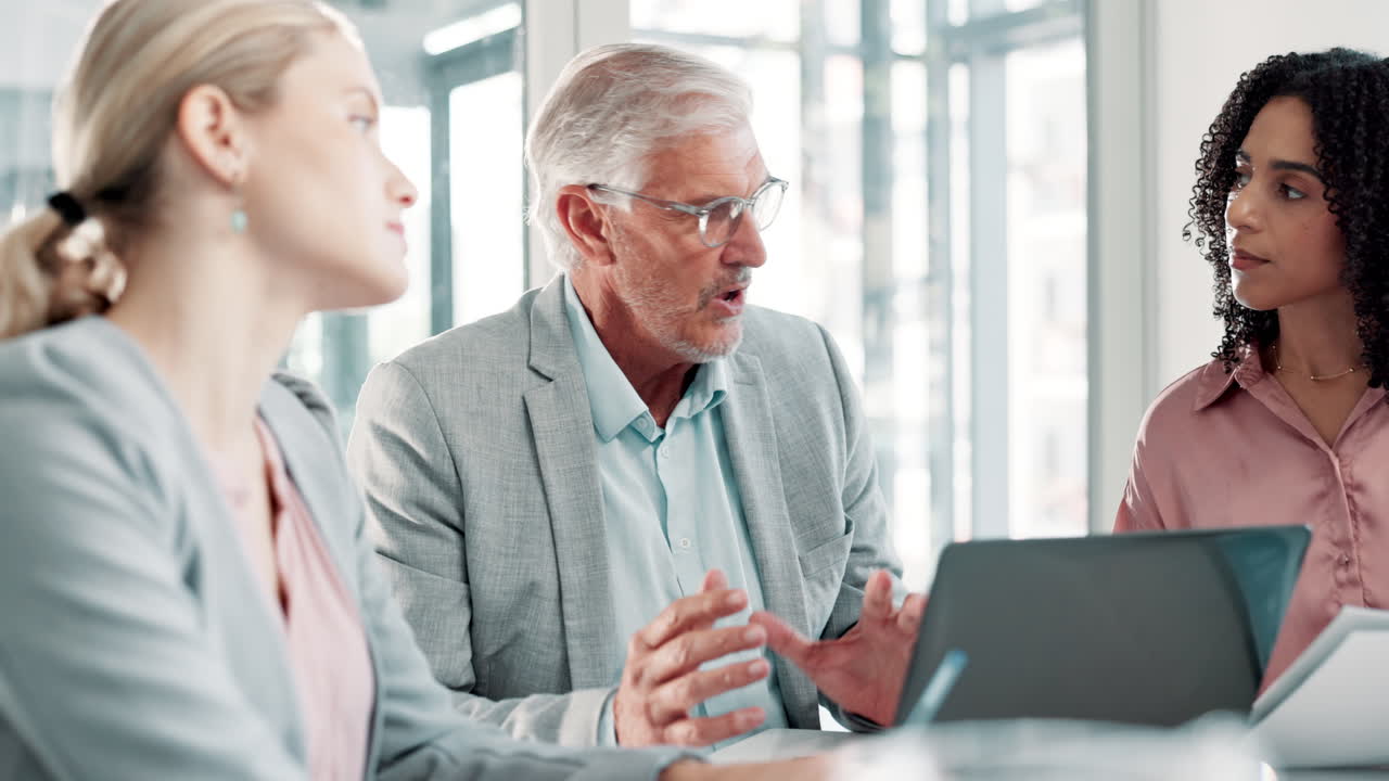 Team of professionals in a business meeting collaborating and discussing strategy