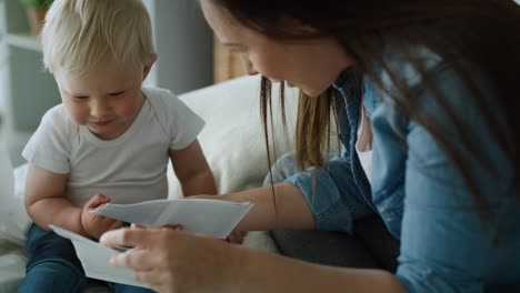 Tracking-right-video-of-mother-and-son-browsing-ultrasound-images.