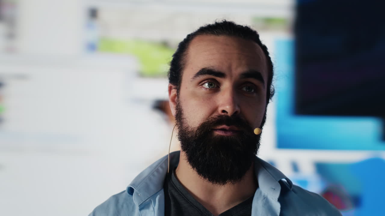 Male public speaker discussing with audience during live social media event