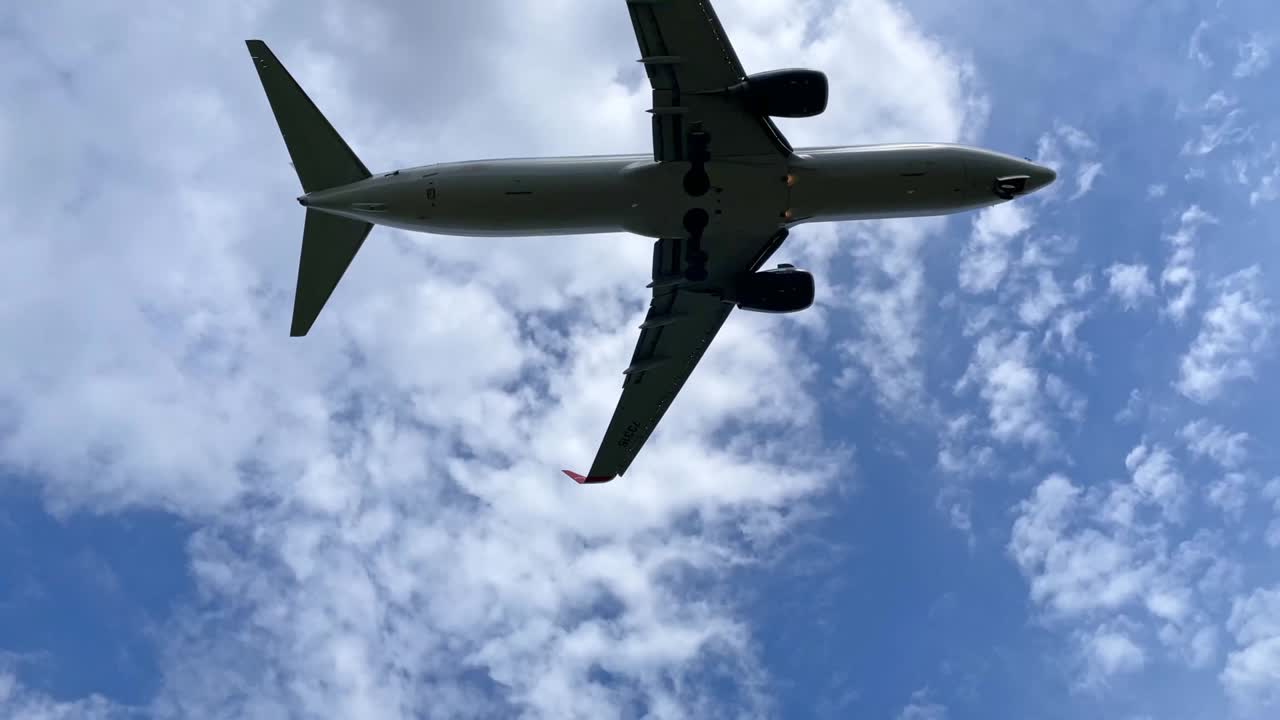 Landing of an airplane flying overhead.