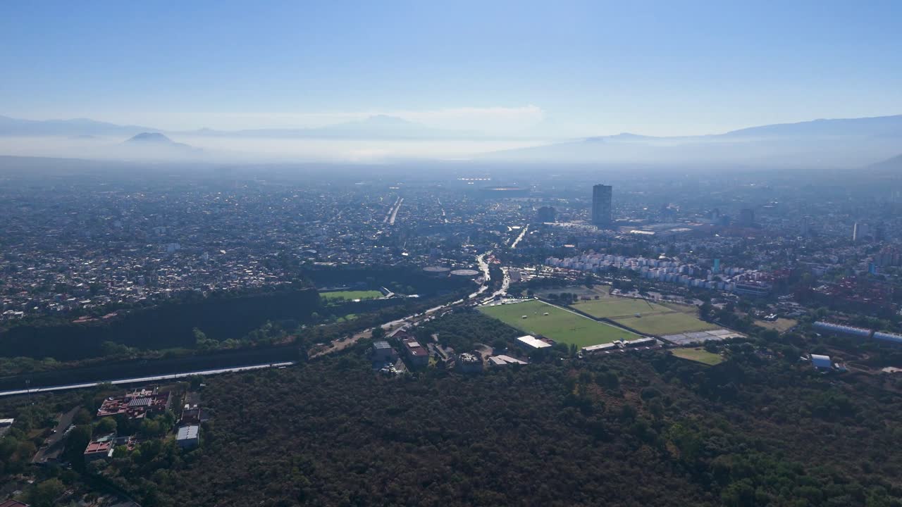 Panoramic view of Mexico City bathed in morning sunlight