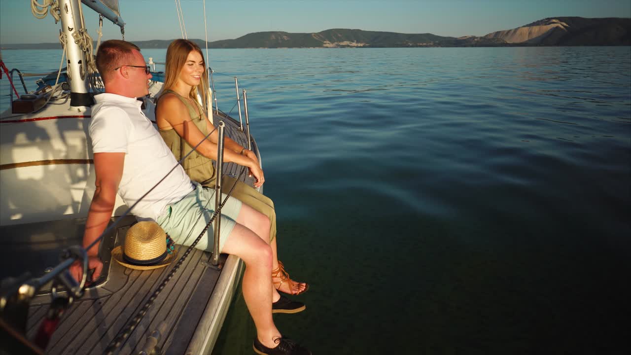 Couple enjoying a sunset cruise on a yacht