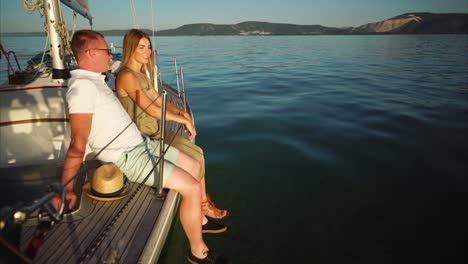 couple enjoying a sunset cruise on a yacht