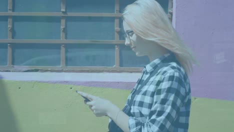 animation of statistics processing over smiling woman using smartphone