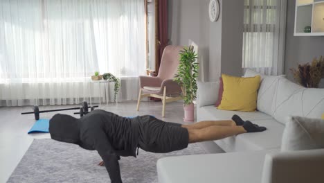 athlete man is training at home.