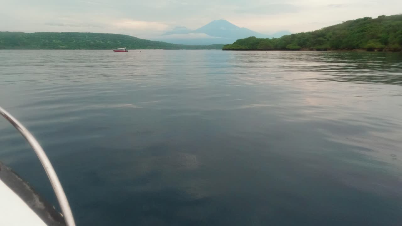 POV footage - Boat Ride near Menjangan Island, Bali. Ride around Menjangan Island – Scenic Ocean Journey off Indonesia Coast