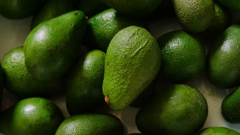 close-up avocado fruits in basket at supermarket 4k