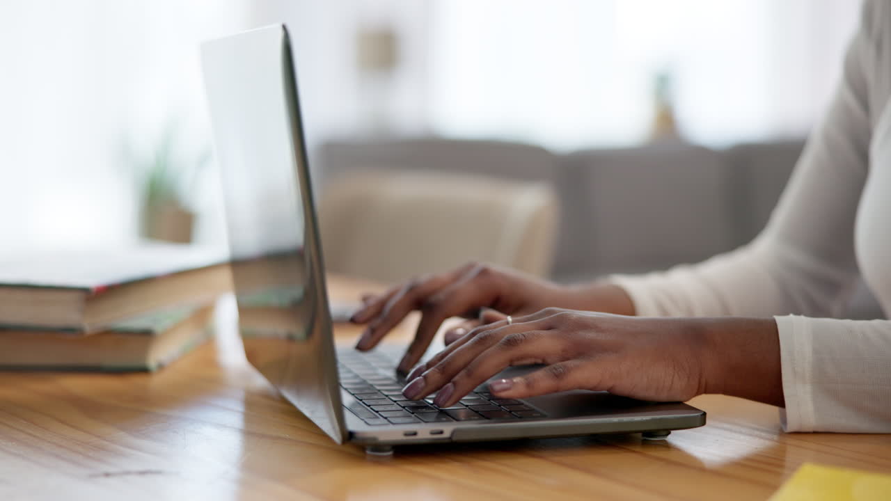 Woman working on laptop at home office