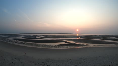 amazing scenery at the sunset: drone above and the sun at the horizon