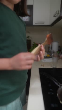 young girl cooking in the kitchen