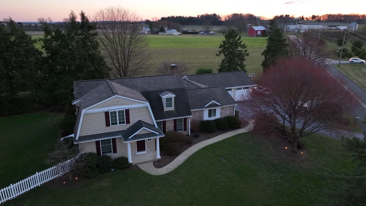 Aerial shot of American home during early spring sunset at night
