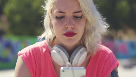 attractive blond woman choosing her music