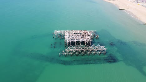 Aerial-drone-footage-of-the-west-pier,-i360-and-Brighton-seafront