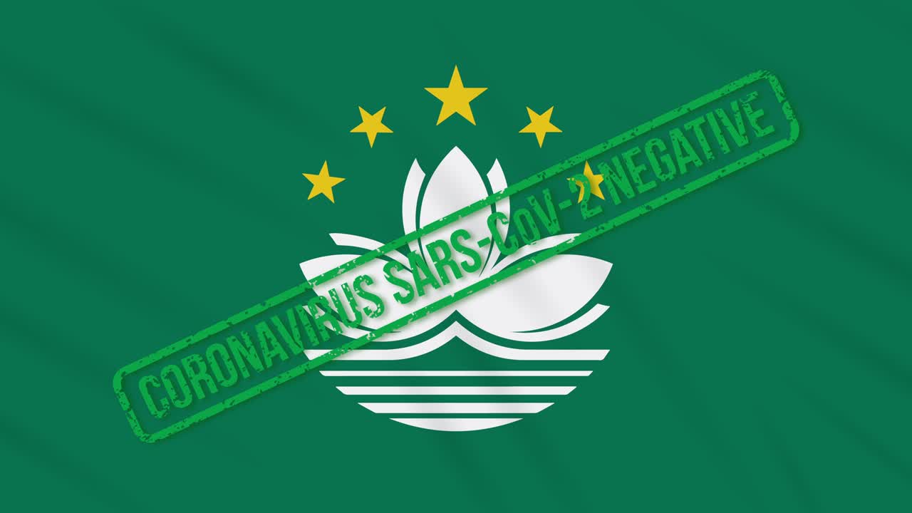 마카오가 코로나 바이러스로부터의 자유의 녹색 스프를 가진 발을 흔들고 있습니다.