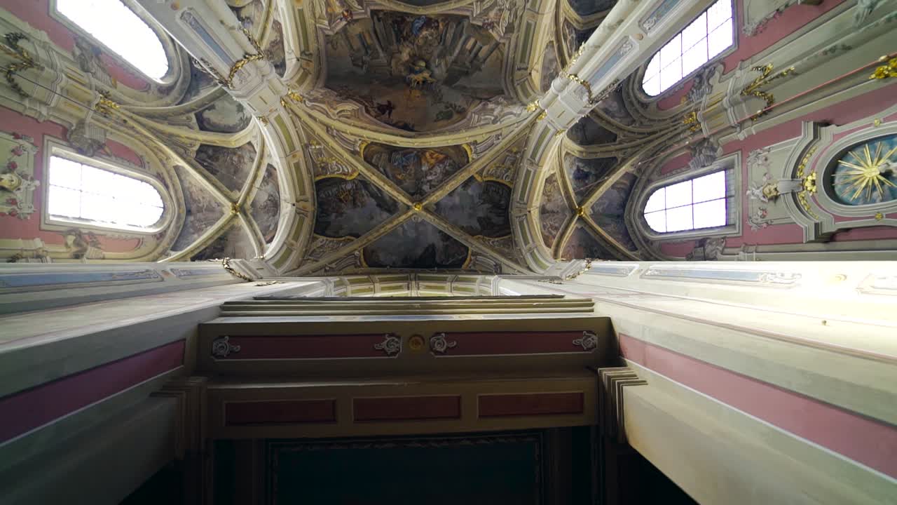 Interior of the old cathedral of the Assumption of the Blessed Virgin Mary. Beautiful view of religious building inside. Camera moves upside down.