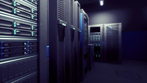 server room with high tech equipment illuminated by blue lights at night