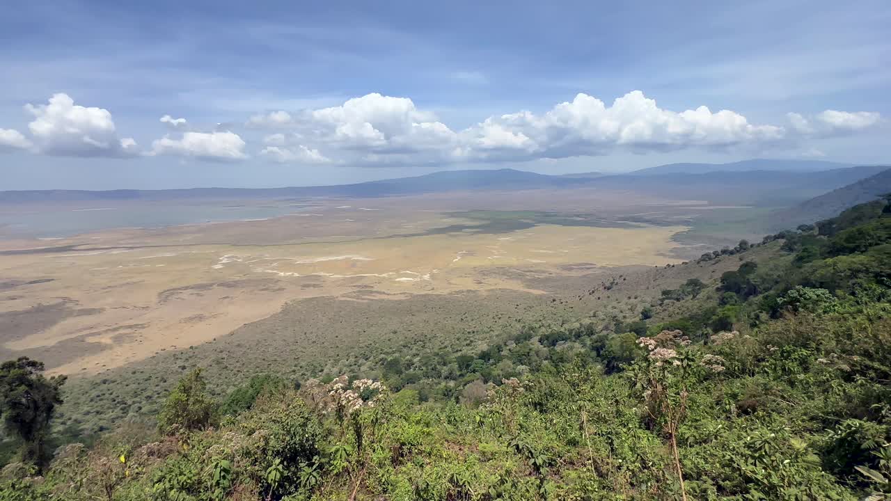 Panoramic view of the Ngorongoro Crater from the viewing platform in sunny weather in Tanzania