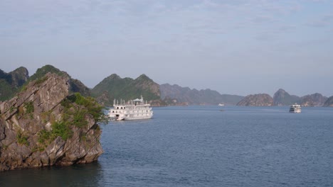 halong bay vietnam cruise. wanderlust of many boats sailing through the thousand islands of ha long bay