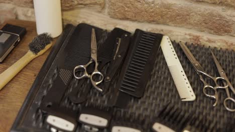 shaving set with equipment, tools and foam, barber shop, scissors, comb on desk