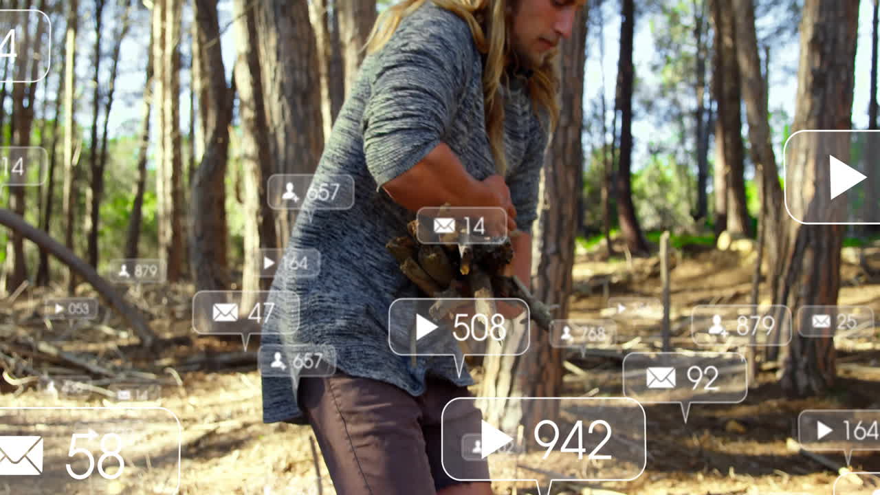 Man gathering firewood in sunlit pine forest, social media marketing icons floating around him