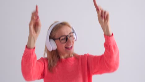 smiling woman dancing while listening to music